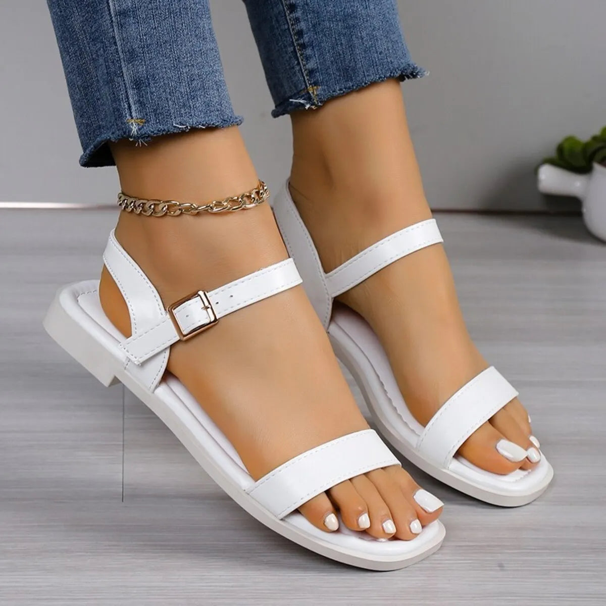 Women's open toe flat slide sandals made of soft PU leather by Plush Fashion Hub, featuring a comfortable slip-on design.