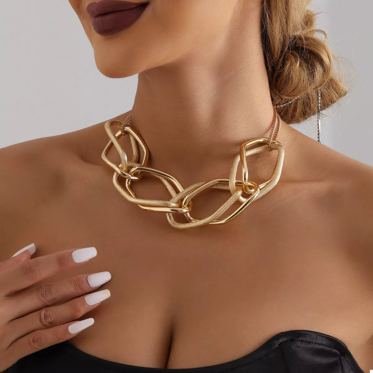 18K gold-plated chain necklace with a delicate link design, displayed on a neutral background.