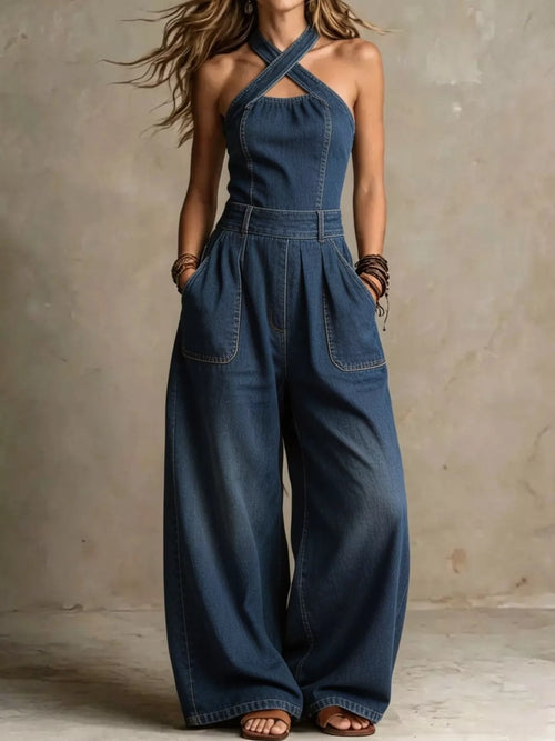 Plus size wide-leg crisscross denim jumpsuit by Trendsi, featuring a full-length design with a stylish, relaxed fit.