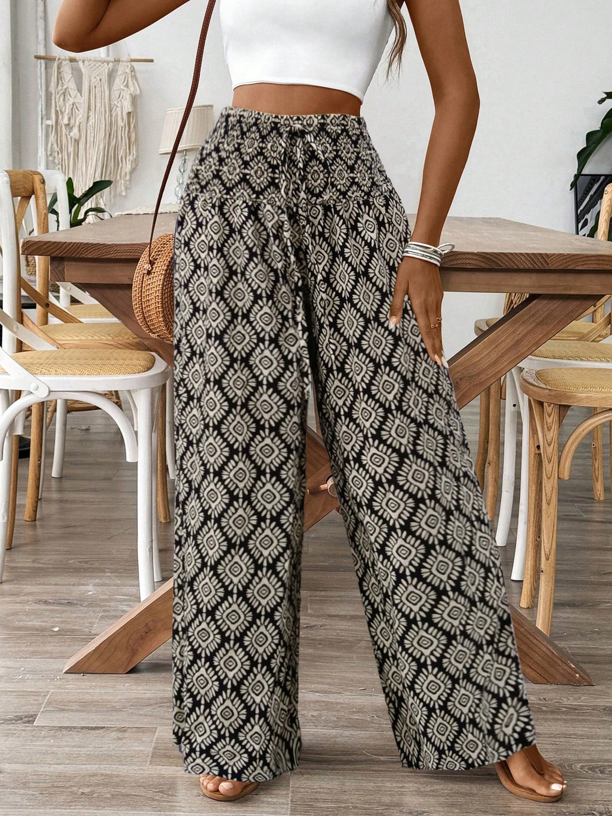 Women’s printed wide leg tie waist pants by Plush Fashion Hub, lightweight high waist trousers with floral pattern and flowing silhouette.