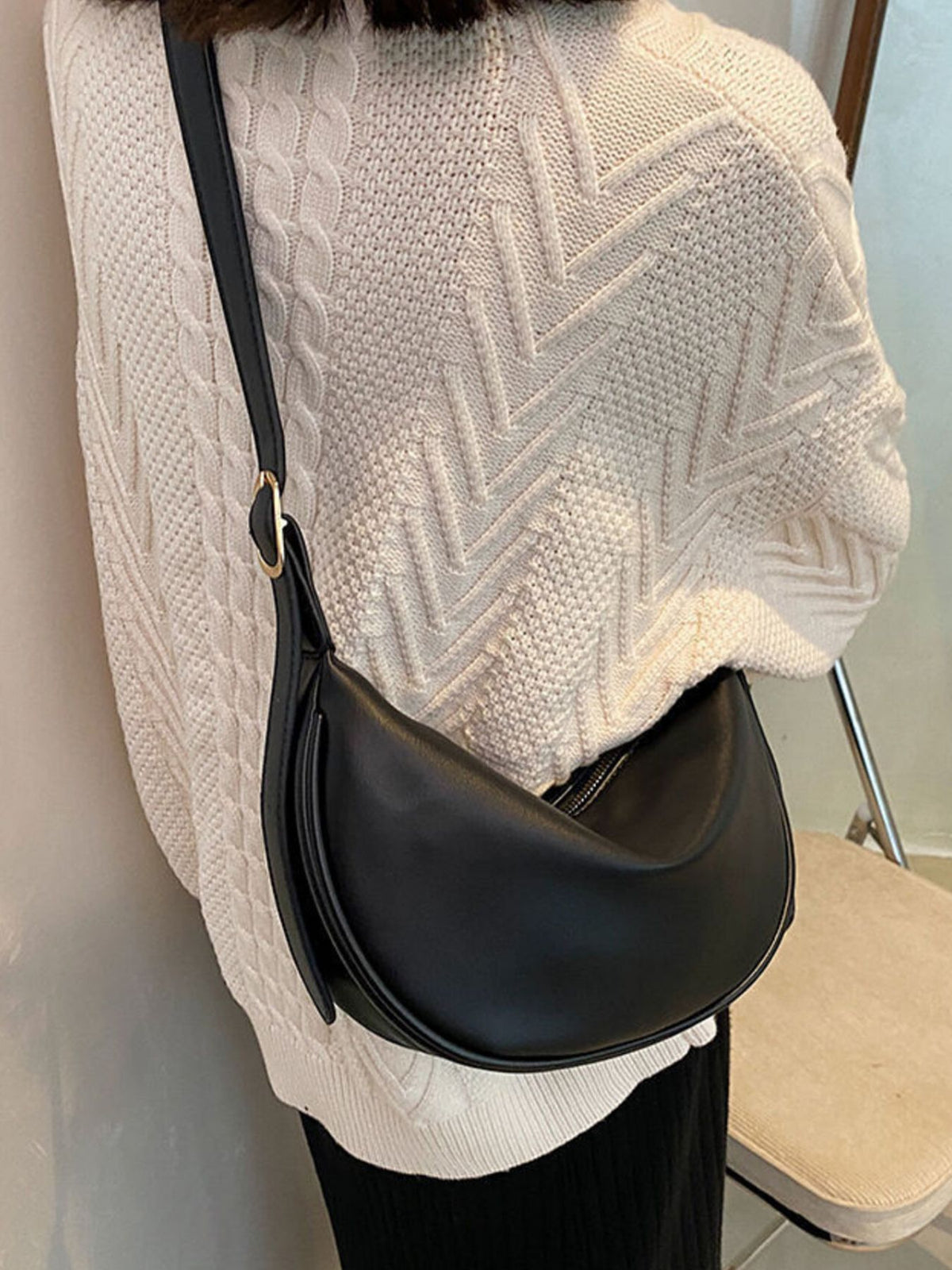 Minimalist crescent crossbody bag in smooth PU leather from Plush Fashion Hub, featuring a sleek, modern design.