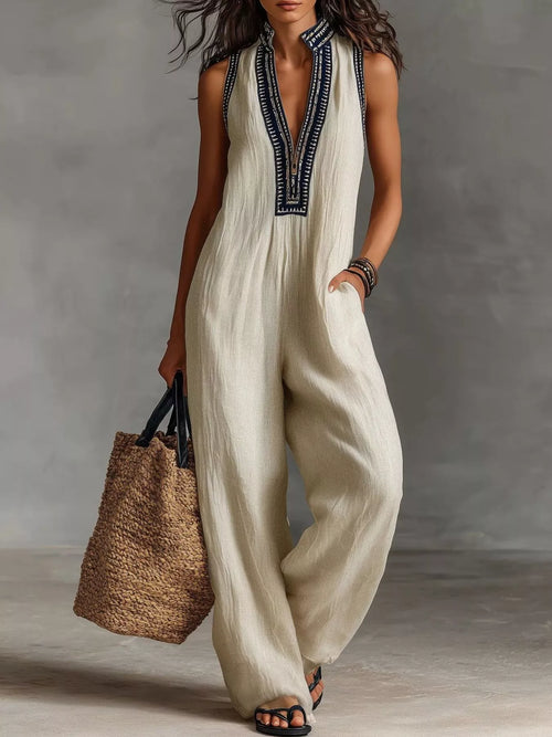 Plus size sleeveless wide-leg jumpsuit by Trendsi, featuring a full-length design and comfortable fit, displayed on a model.