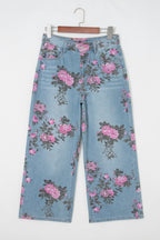 Threaded Pear Esme floral print bootcut jeans with colorful flower pattern and classic denim fit, displayed on a hanger.
