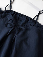 Lace trim cami and wide-leg pants set by Trendsi, featuring a stylish matching outfit with delicate lace details.