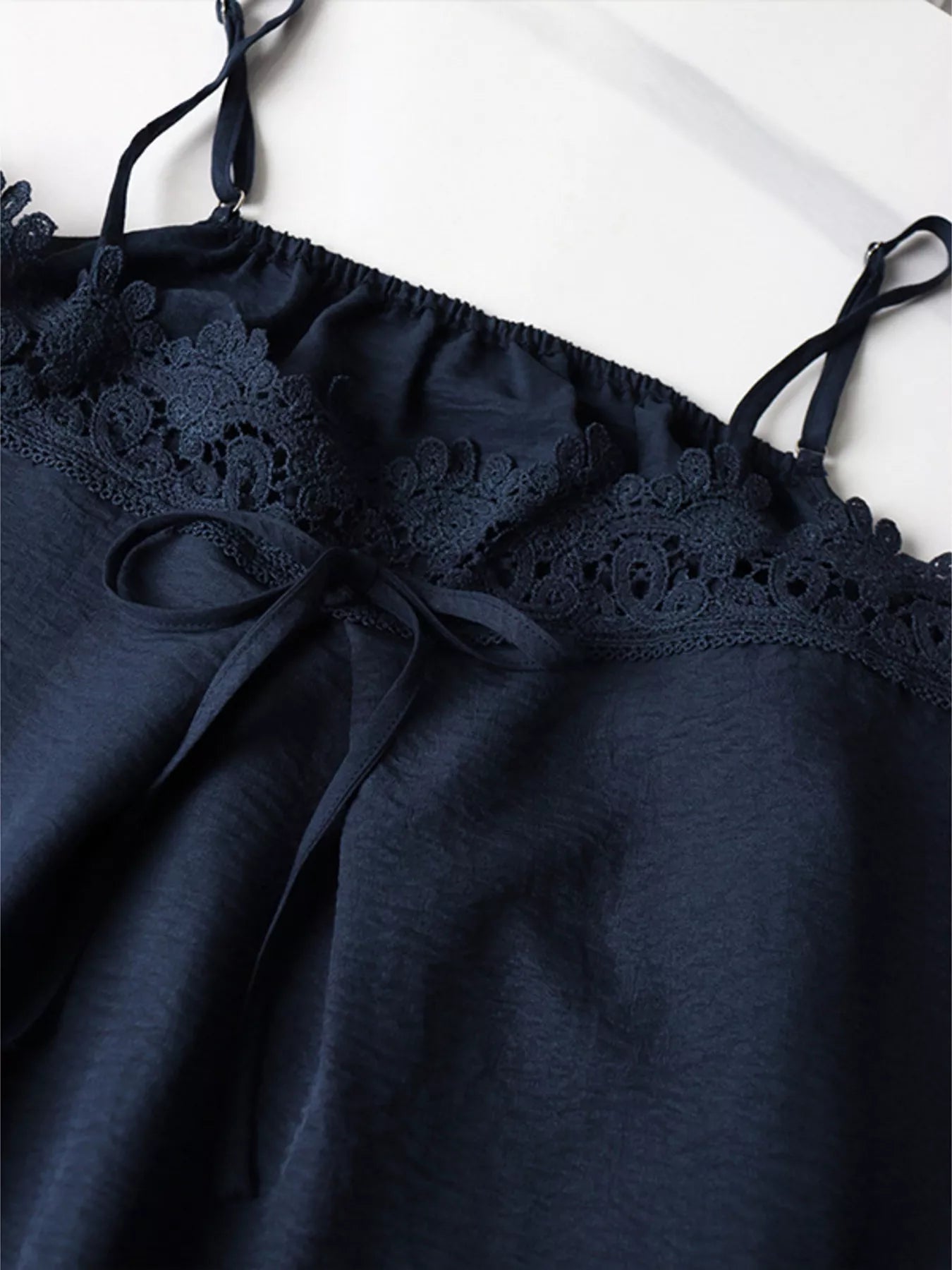 Lace trim cami and wide-leg pants set by Trendsi, featuring a stylish matching outfit with delicate lace details.