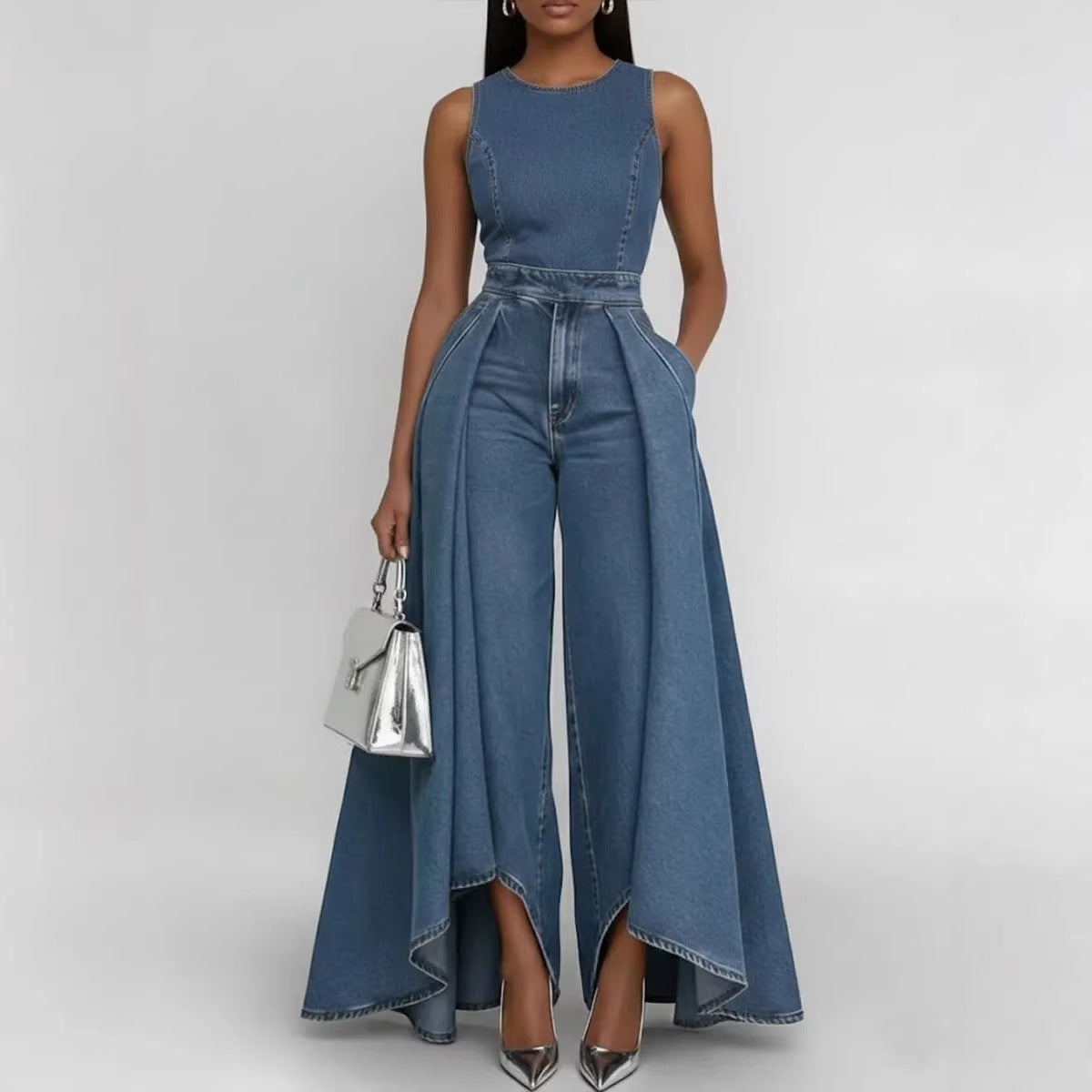 Women’s sleeveless wide-leg denim jumpsuit by FitiqueFit featuring a casual crew neck and relaxed fit, shown on a model.