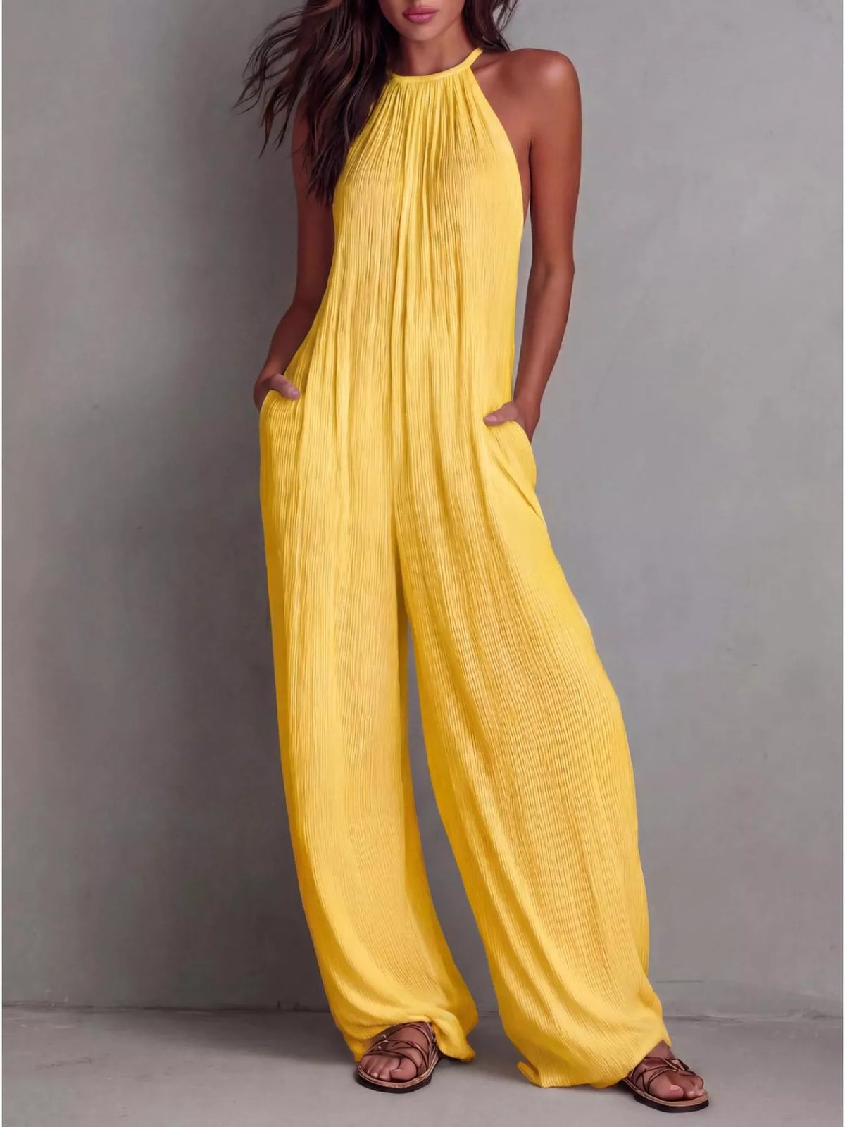 Plush Fashion Hub sleeveless wide-leg jumpsuit in light fabric, displayed on a hanger with a neutral background.