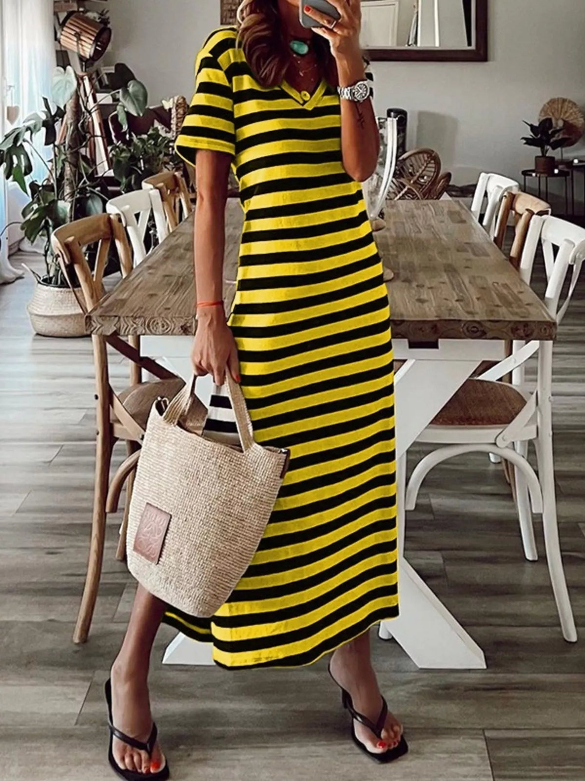Plus size striped V-neck midi dress with side slit by Trendsi, featuring a comfortable fit and stylish design.