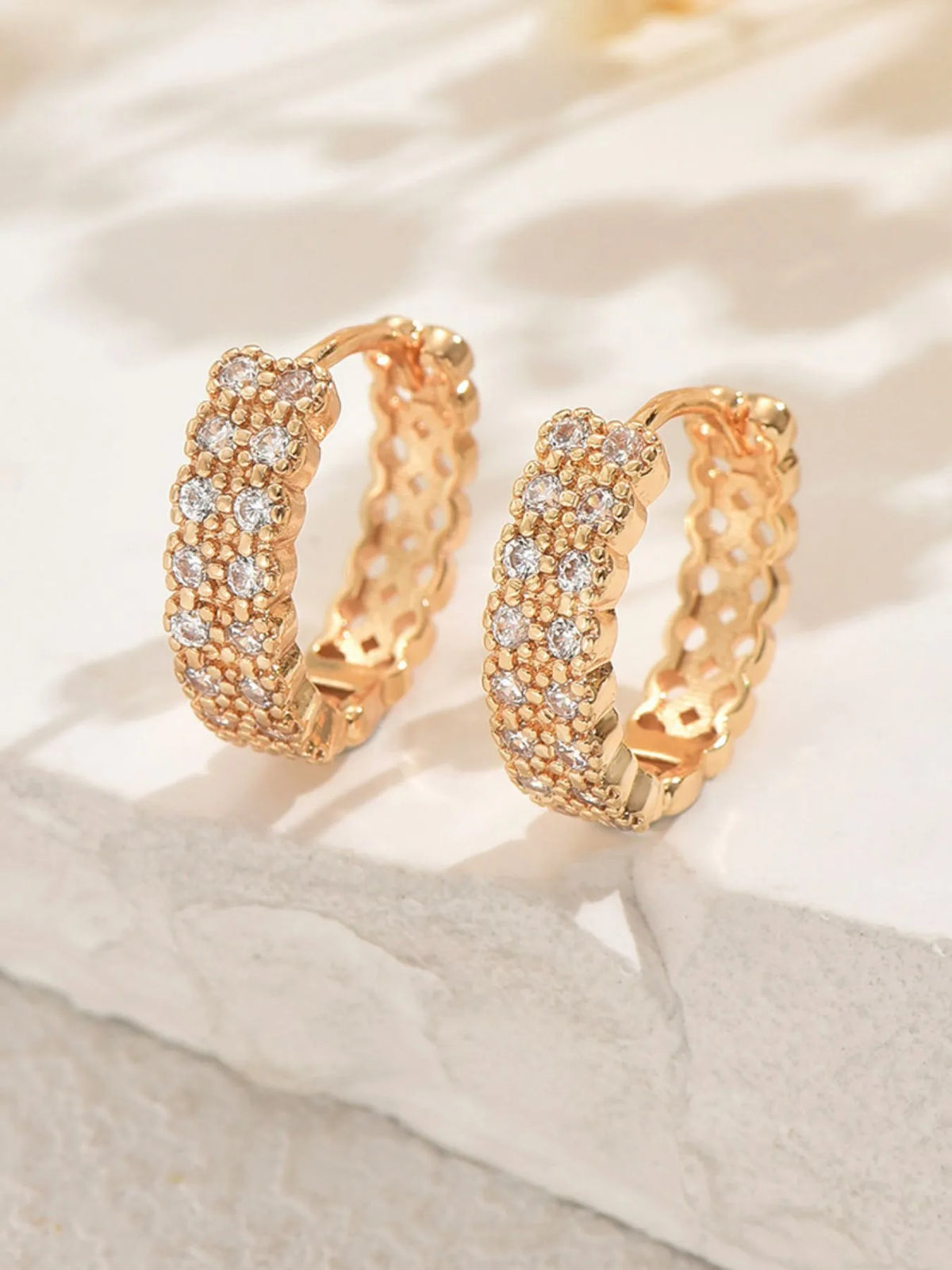 Plush Fashion Hub Inland Zircon Hoop Earrings with sparkling zircon stones and gold-tone hoop design, close-up shot.