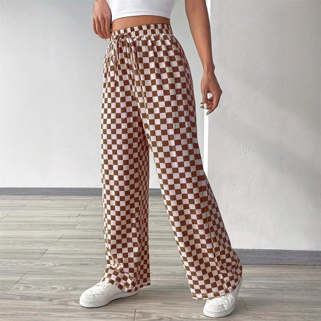 Checkerboard high-waisted wide-leg pants from Plush Fashion Hub in four colors, shown with a stylish fit and bold pattern.