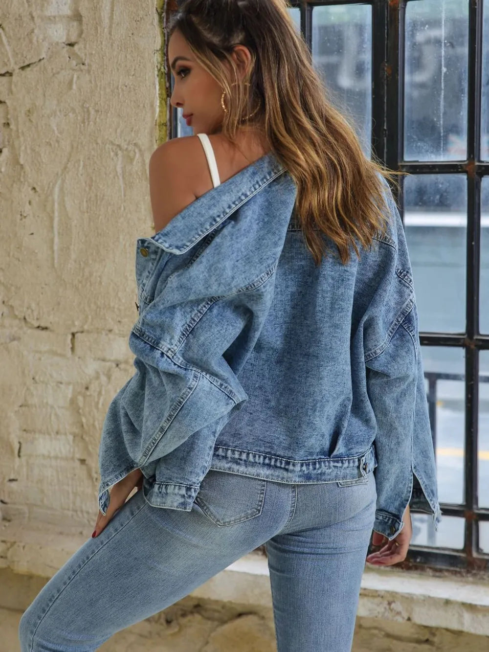 Light blue denim jacket with drop shoulder design and button-down front, styled as trendy denim jeans by Trendsi.