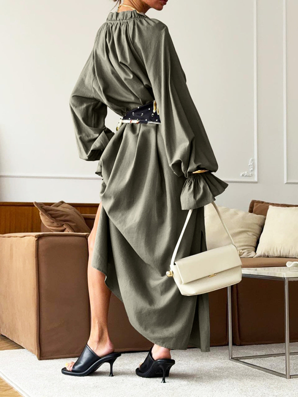 Cotton linen maxi dress with tie neck and flounce sleeves from Plush Fashion Hub, displayed on a hanger.