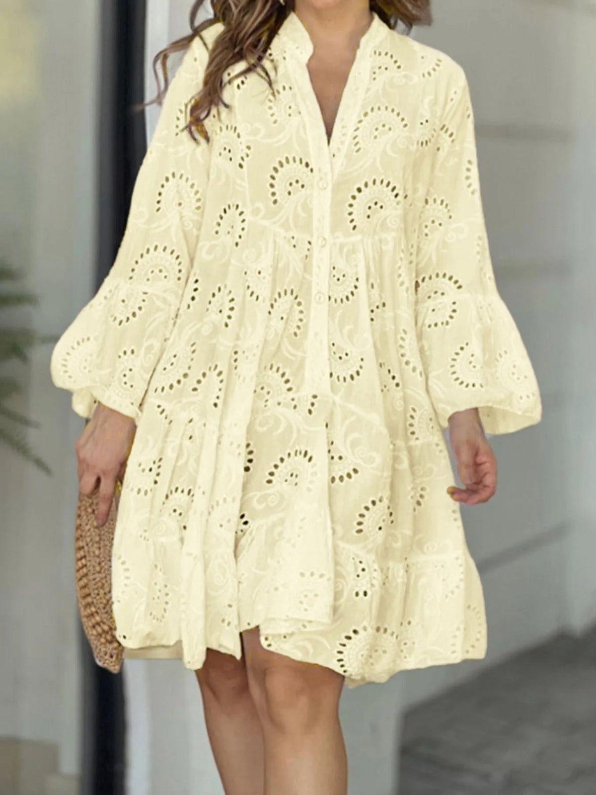 Plus size full-length eyelet ruffled hem tiered dress by Trendsi with floral details and flowing silhouette.
