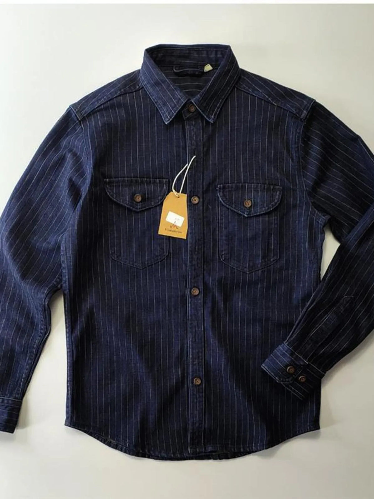 Men's plus size denim shirt with navy and white stripes, button-up style from Trendsi, shown with collar and long sleeves.