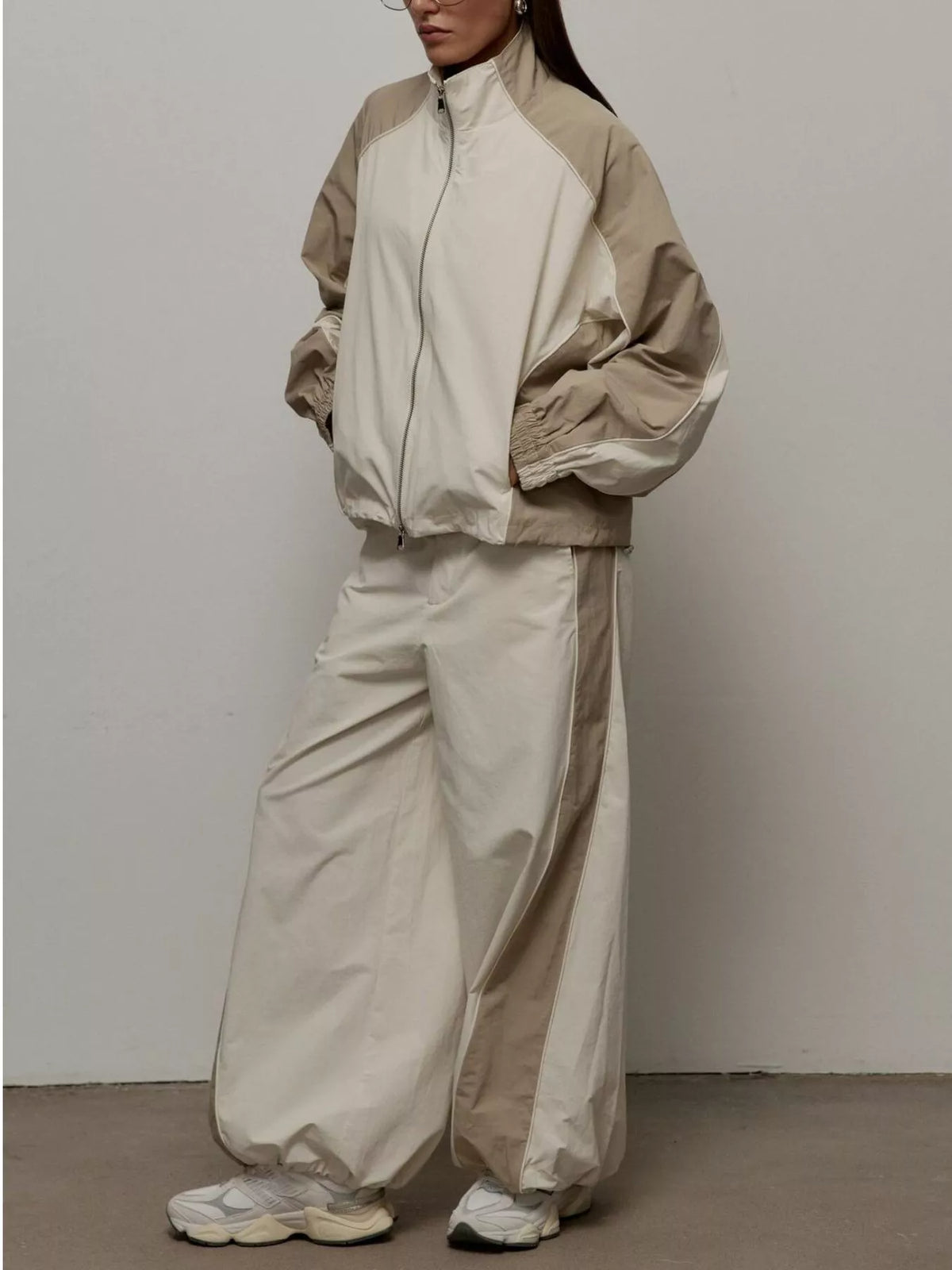 Color block zip-up outerwear and pants set by Plush Fashion Hub, featuring a stylish, coordinated casual outfit.