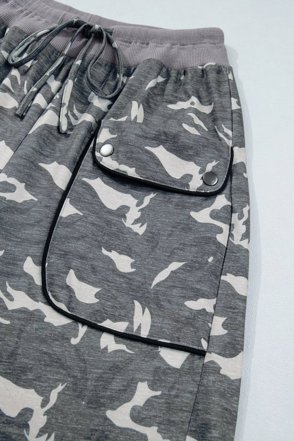 Multicolour camouflage cargo pants with drawstring waist and contrast waistband, made by Plush Fashion Hub.