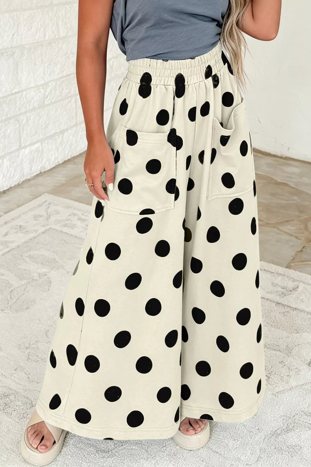 Polka dot wide-leg casual pants with elastic waist from Trendsi, featuring a relaxed fit and stylish polka dot pattern.