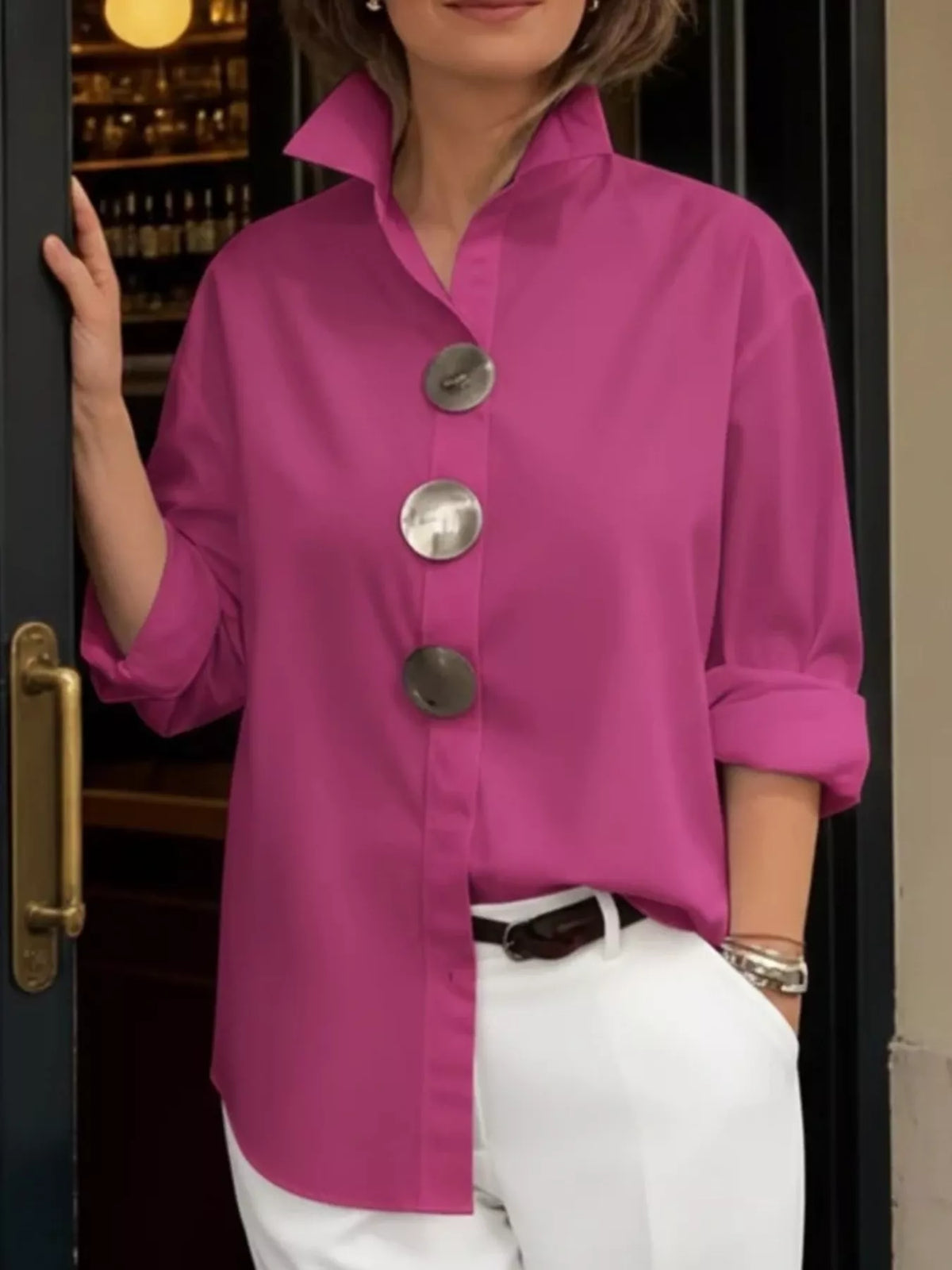 Plus size oversized metal button long sleeve shirt by Trendsi, featuring a relaxed fit and metal buttons on a stylish shirt.