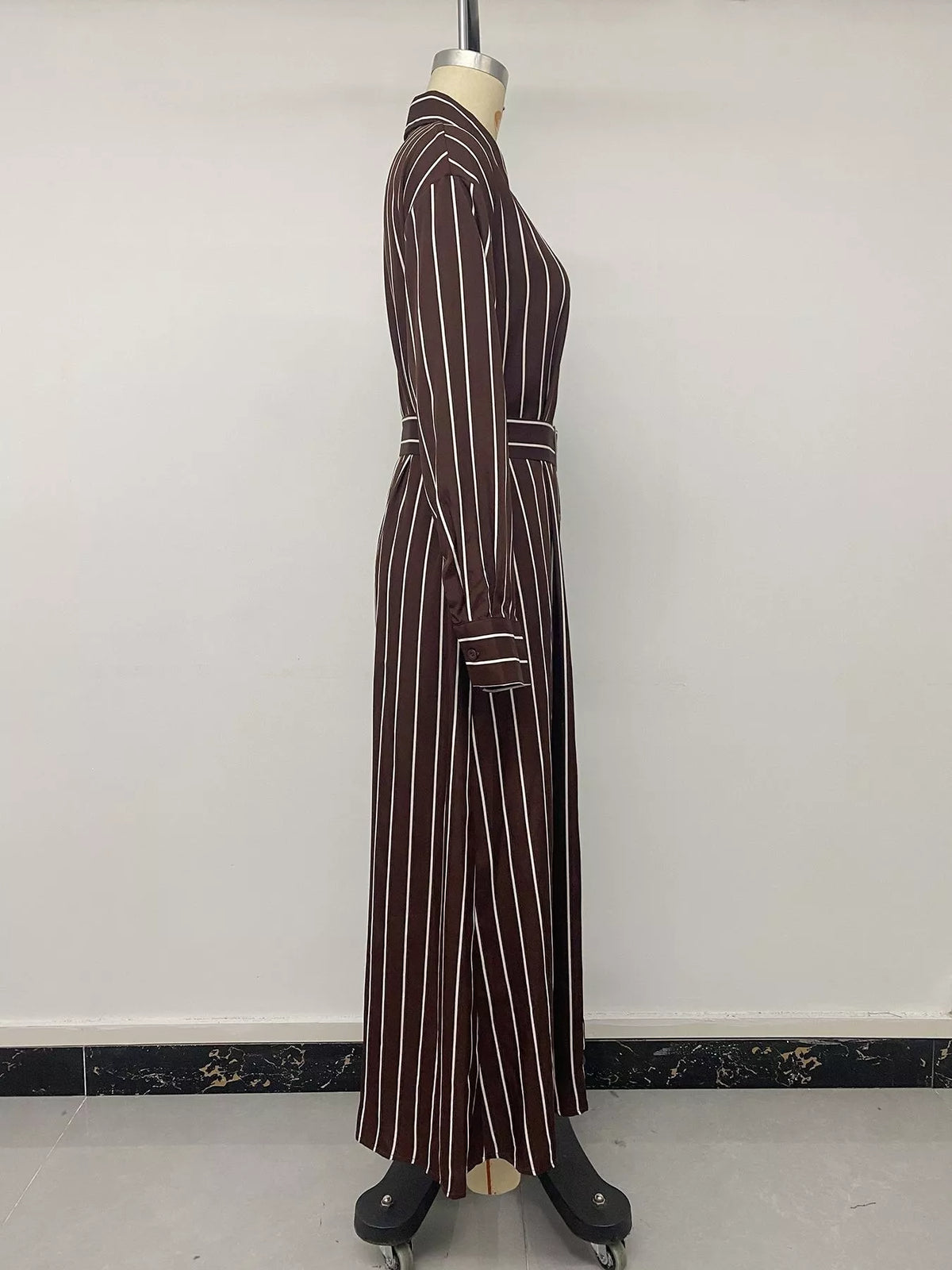 Striped long sleeve belted shirt dress for women by Trendsi, featuring a classic collar, waist belt, and button-down front.