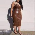 Plus size women's stylish autumn winter leather dress with a fitted silhouette and long sleeves, perfect for cold weather.
