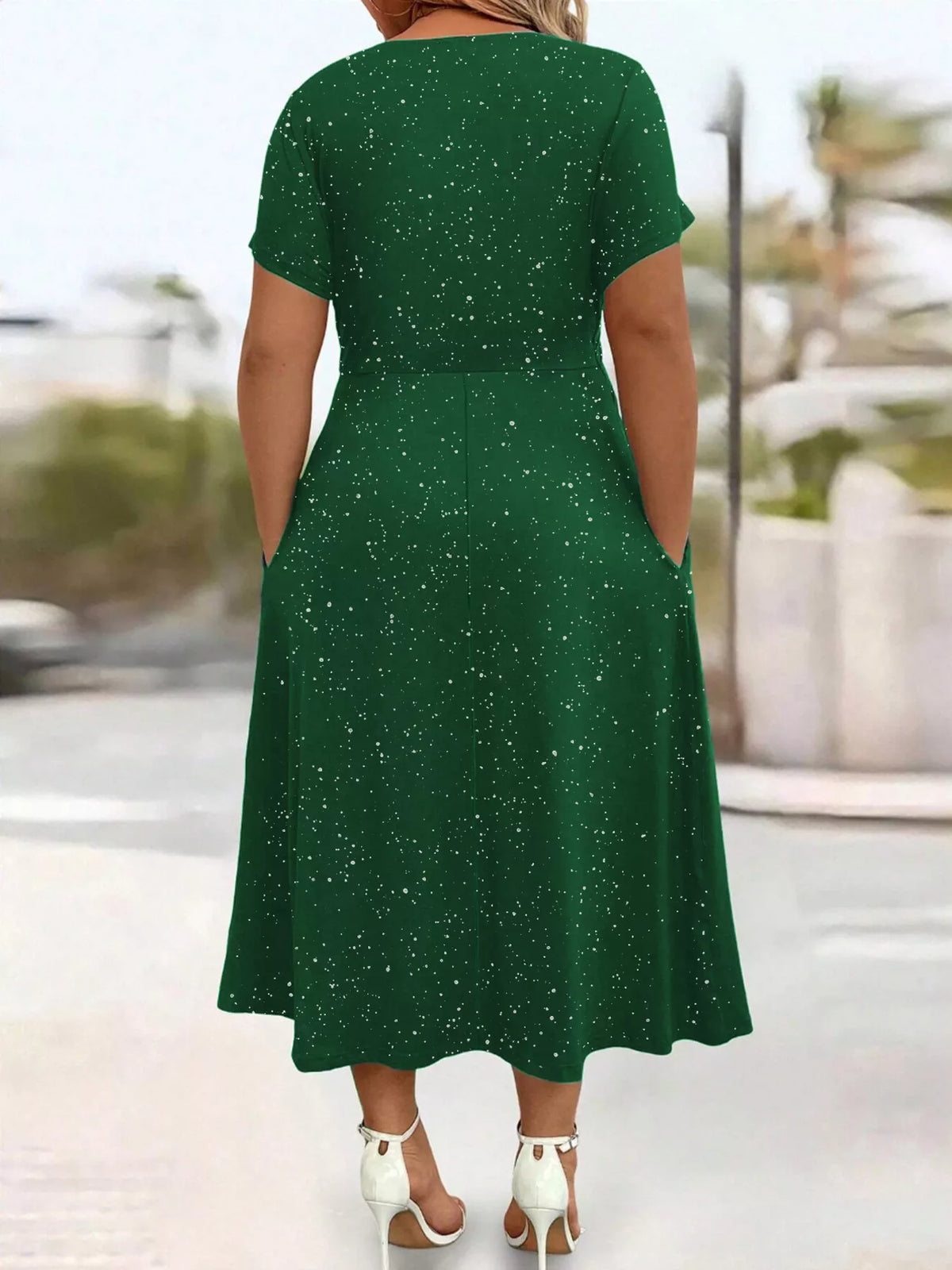 Plus size glitter flutter sleeve midi dress by Trendsi, featuring a full-length silhouette with shimmering fabric and flutter sleeves.