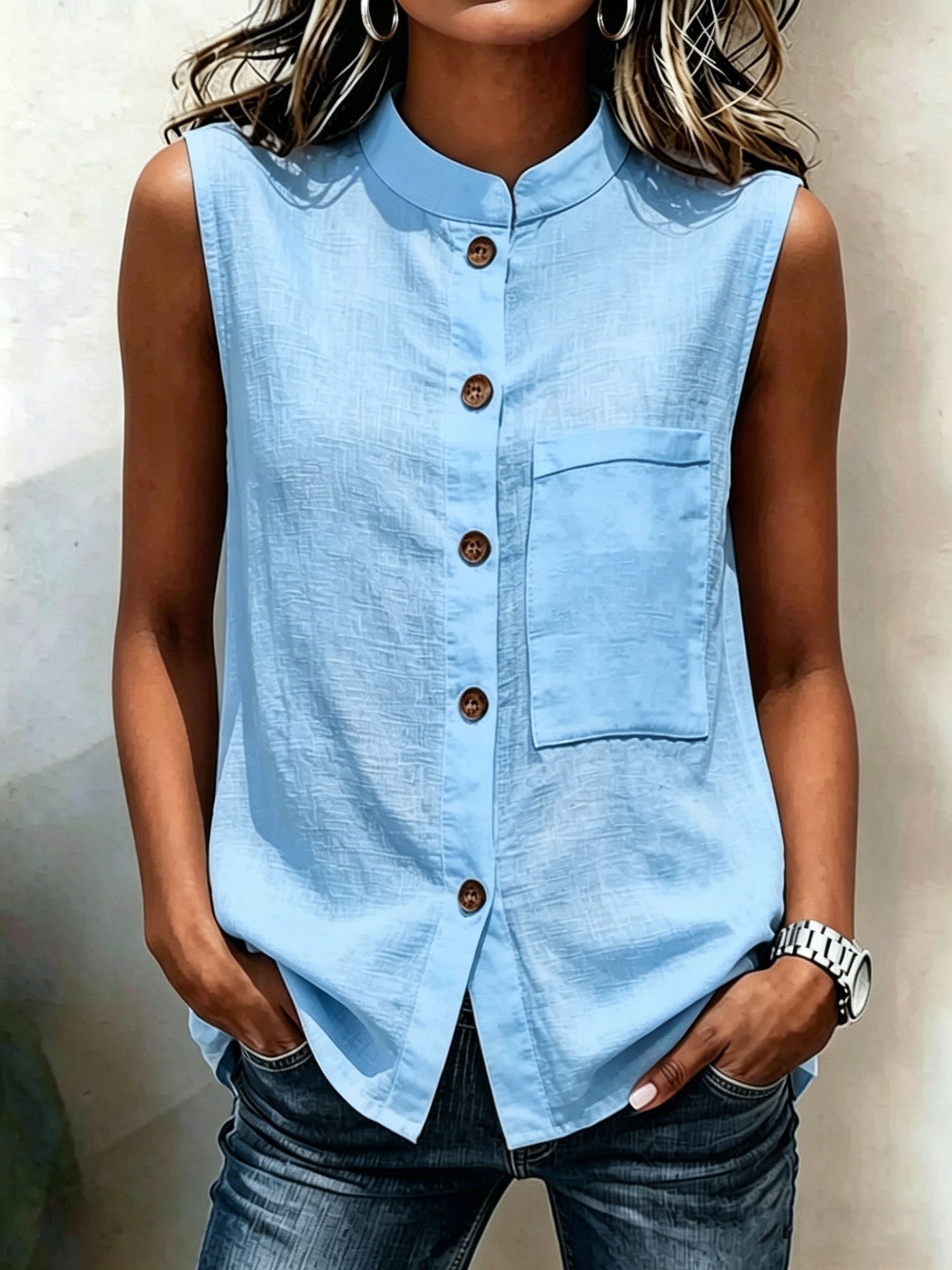 Women's sleeveless crop top with buttoned pockets in solid color, casualwear by FitiqueFit, shown in water-inspired pattern.
