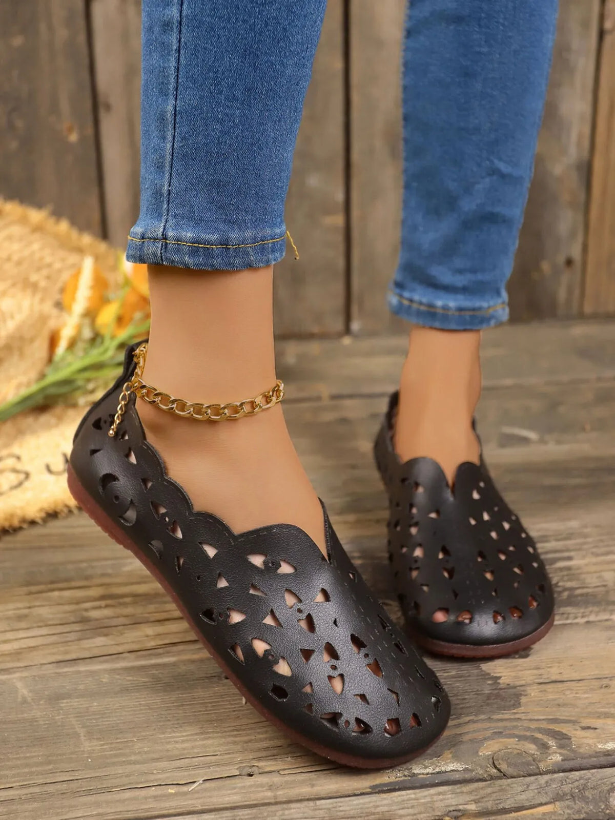 Perforated leather slip-on loafers in neutral color, stylish footwear by Trendsi with breathable design and sleek silhouette.