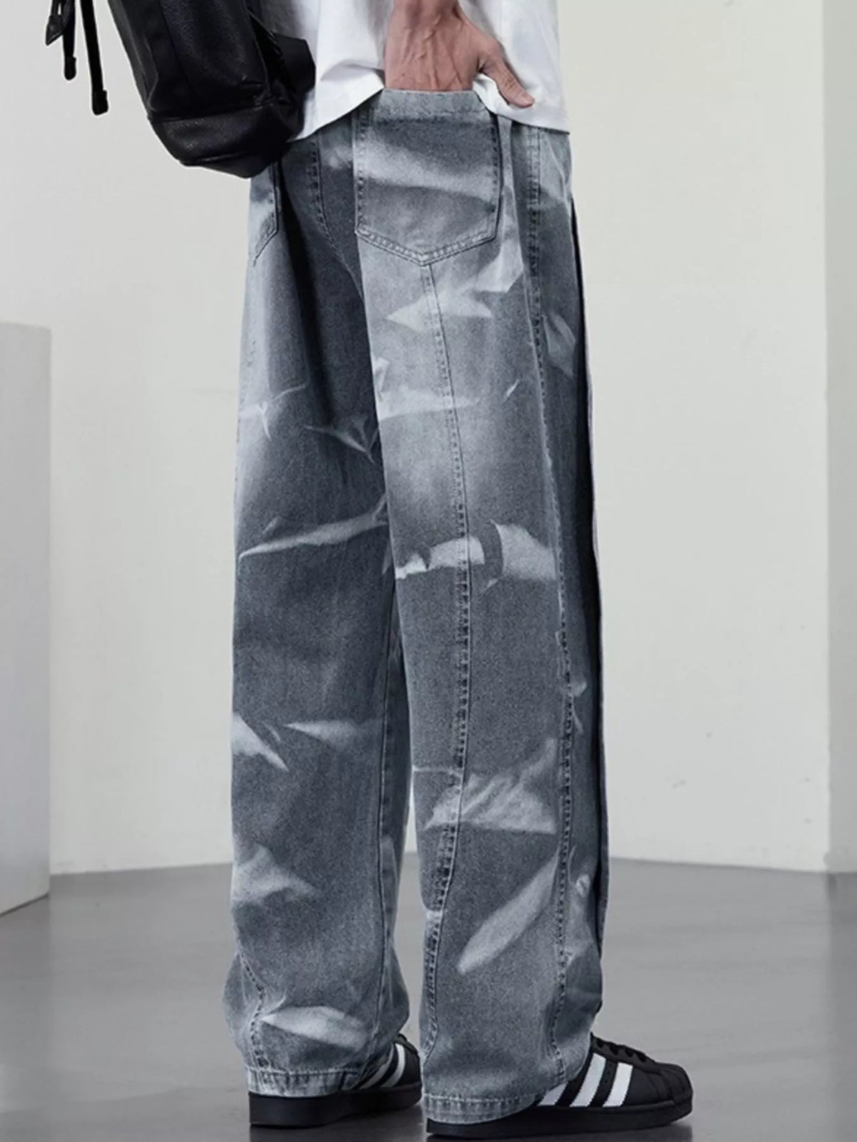 Men's plus size washed wide-leg jeans from Plush Fashion Hub, showing the relaxed fit and faded denim fabric.