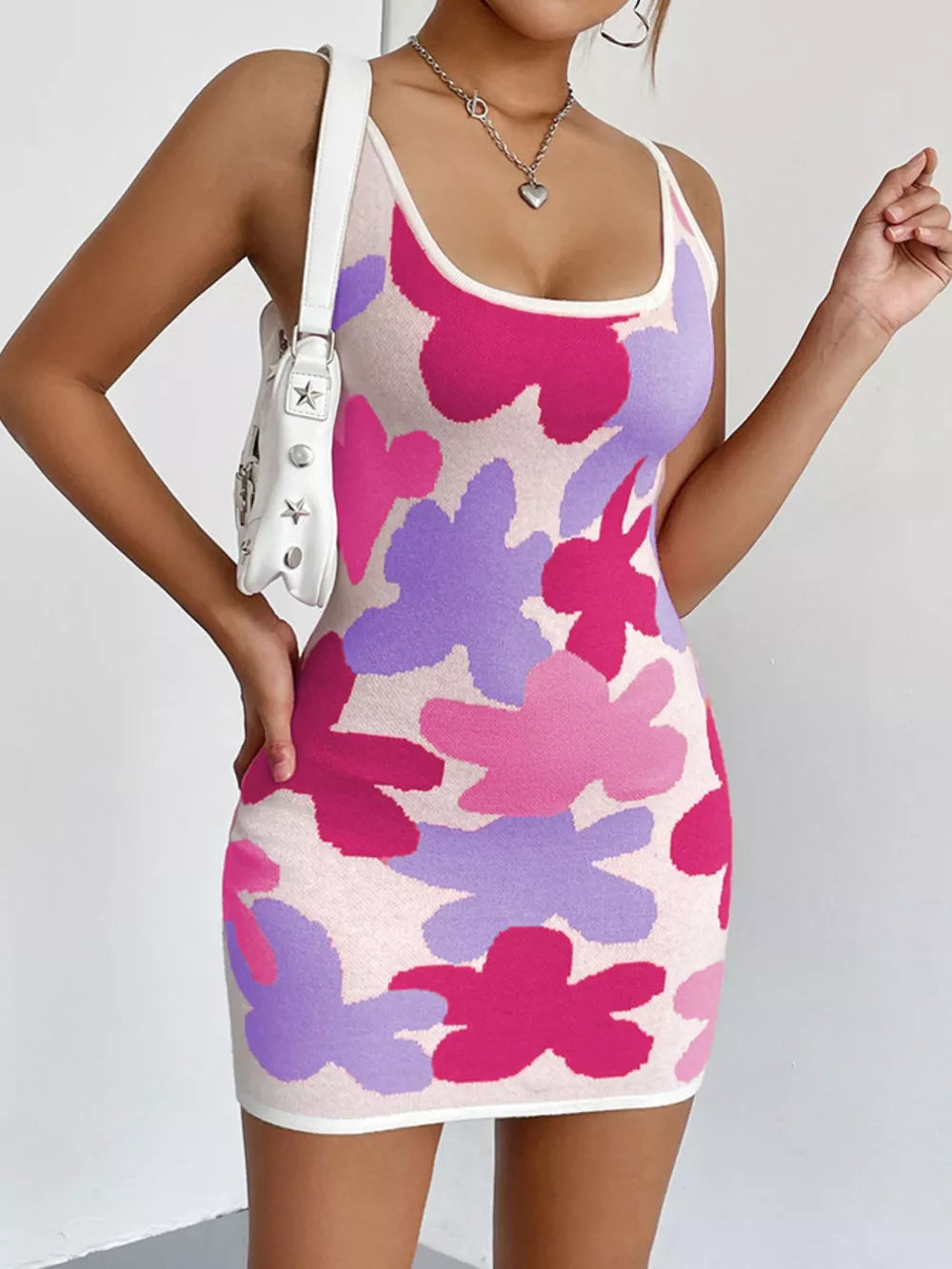 Floral knit scoop neck mini dress from Plush Fashion Hub featuring a fitted silhouette and vibrant floral pattern.