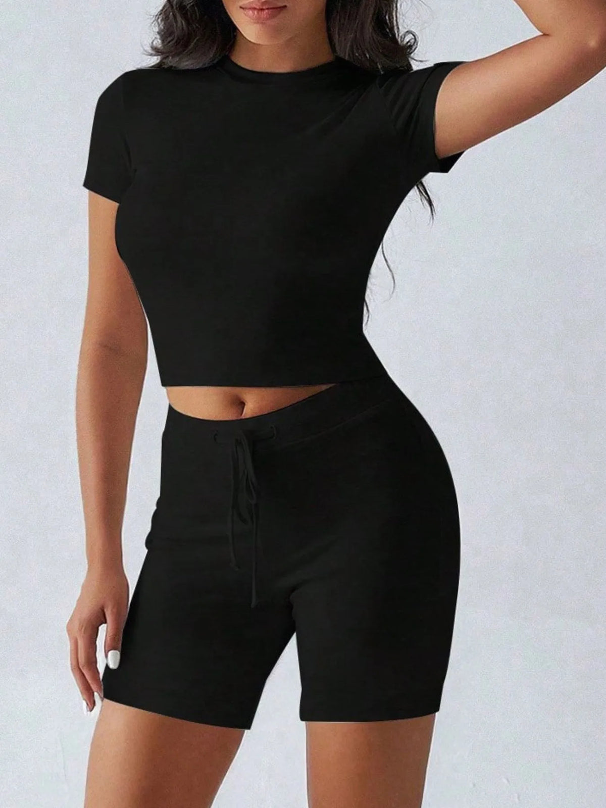 Plush Fashion Hub active wear set with round neck short sleeve top and matching shorts, perfect for workout or casual wear.