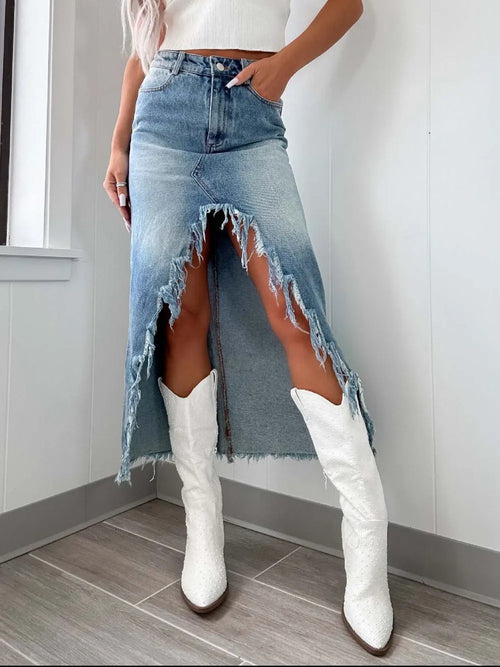 High-waist raw hem asymmetry denim skirt by Trendsi, featuring distressed raw edges and asymmetrical hem detail.