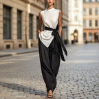 White women's lace-up sleeveless top and wide-leg pants two-piece casualwear set by FitiqueFit, displayed on a model.