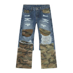 Distressed camouflage patchwork jeans by Trendsi showing ripped fabric, camouflage pattern, and patch details on denim.