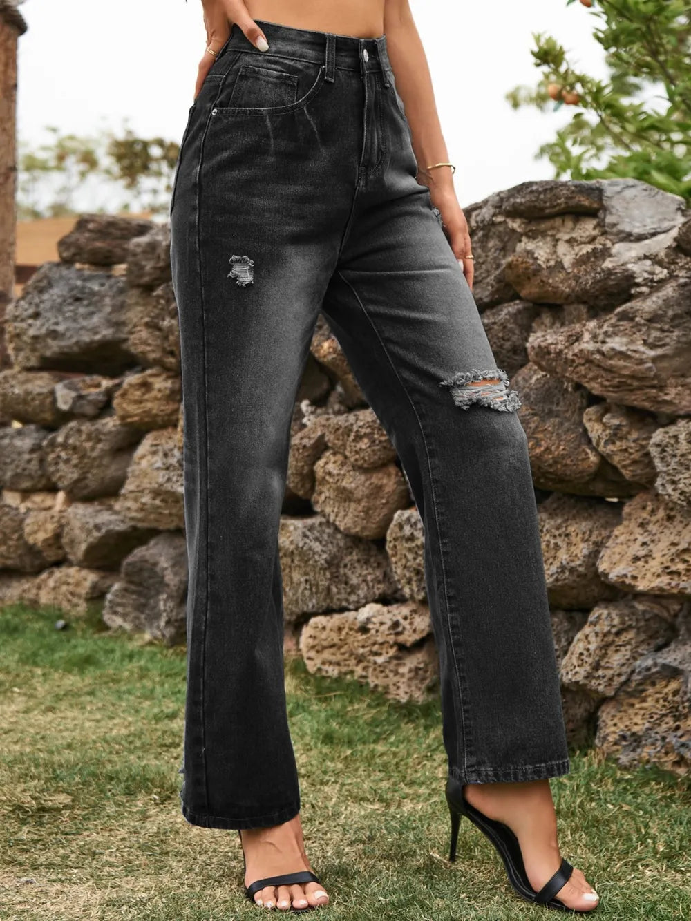 Distressed denim jeans with pockets from Plush Fashion Hub, featuring a faded, ripped design and classic five-pocket style.
