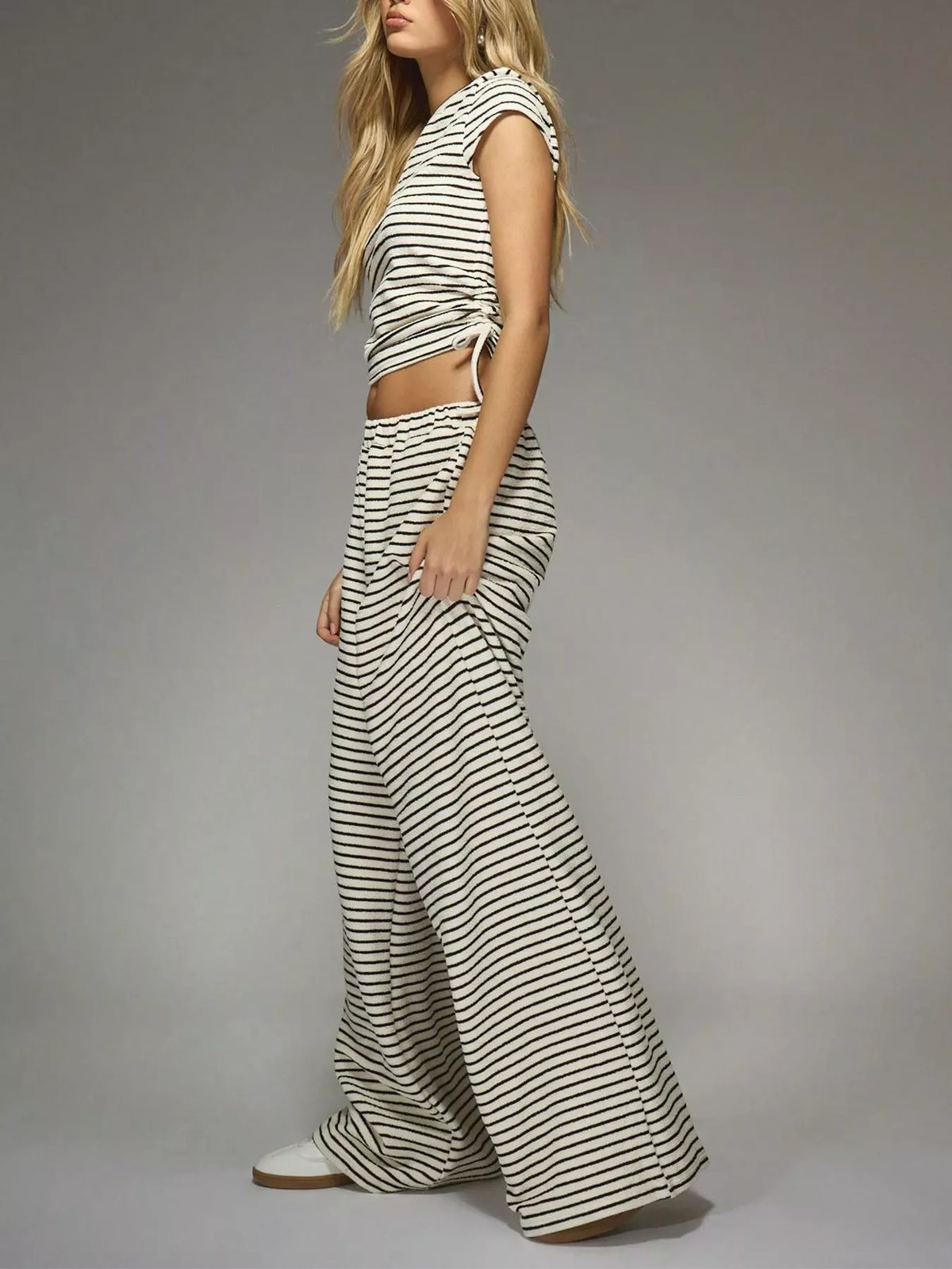 Striped crop top and wide-leg pants outfit set by Plush Fashion Hub, stylish and comfortable dress with bold stripe pattern.