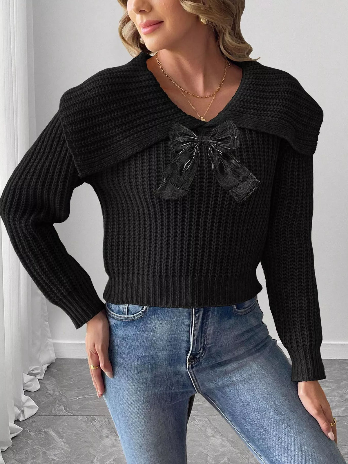 Contrast bow long sleeve sweater paired with skirts, featuring a stylish design and cozy fit from Trendsi.