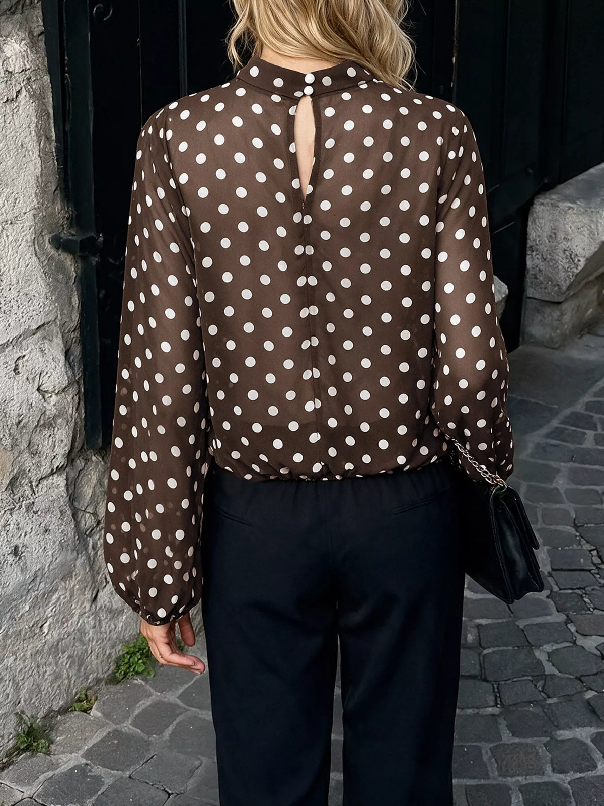Polka dot mock neck long sleeve blouse by Trendsi featuring a classic design and stylish pattern, perfect for casual or office wear.
