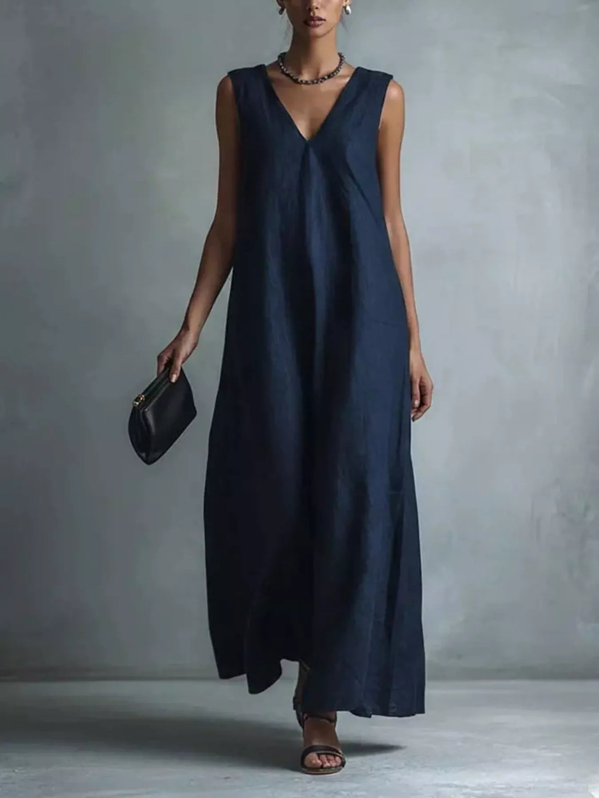 Plus size full V-neck sleeveless maxi dress by Plush Fashion Hub, flowing length and comfortable fit in a vibrant print.