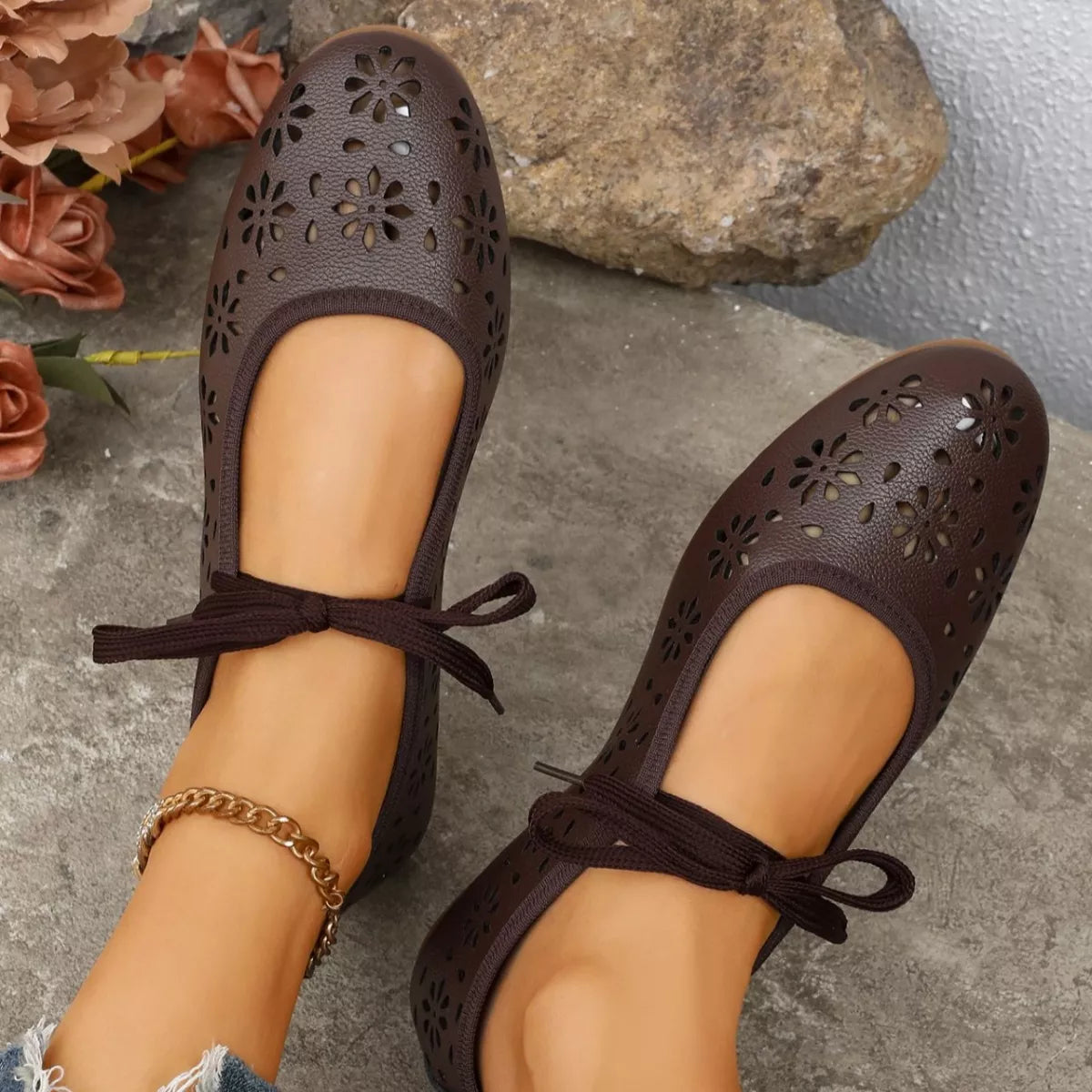 Floral cutout tied slip-on sandals by Plush Fashion Hub featuring open toes and decorative floral accents, perfect for warm weather.