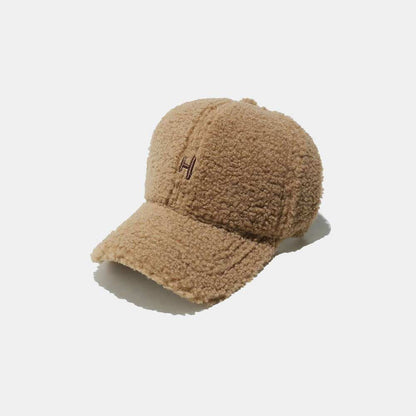 Sherpa Letter H embroidered cap with brown textured design.