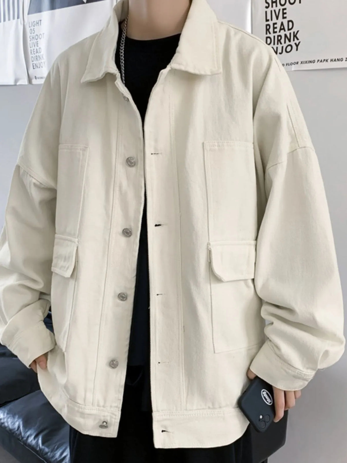 Men's drop shoulder denim jacket by Trendsi, featuring button-up front and casual style, shown on a model.