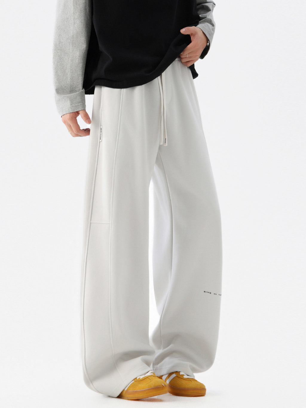 Men's wide-leg casual drawstring pants with relaxed fit, stylish trousers from Trendsi shown in the image.
