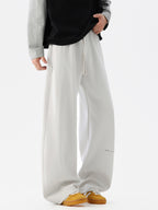 Men's wide-leg casual drawstring pants with relaxed fit, stylish trousers from Trendsi shown in the image.