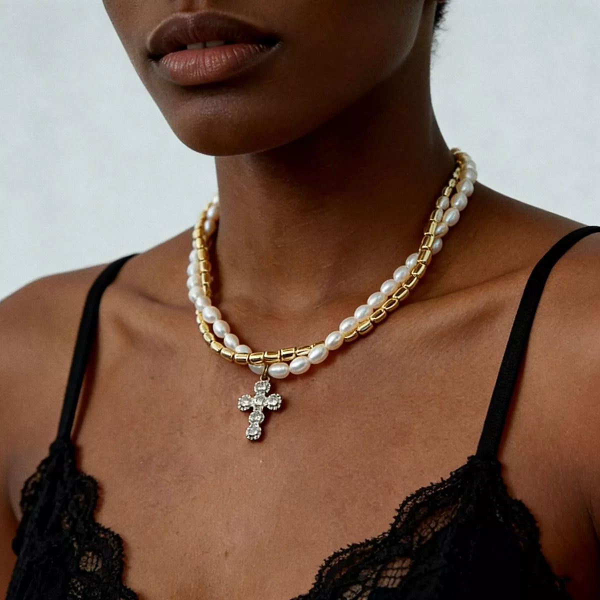 Elegant pearl alloy necklace with rhinestone cross pendant, stylish jewelry accessory featuring a delicate design and shiny accents.