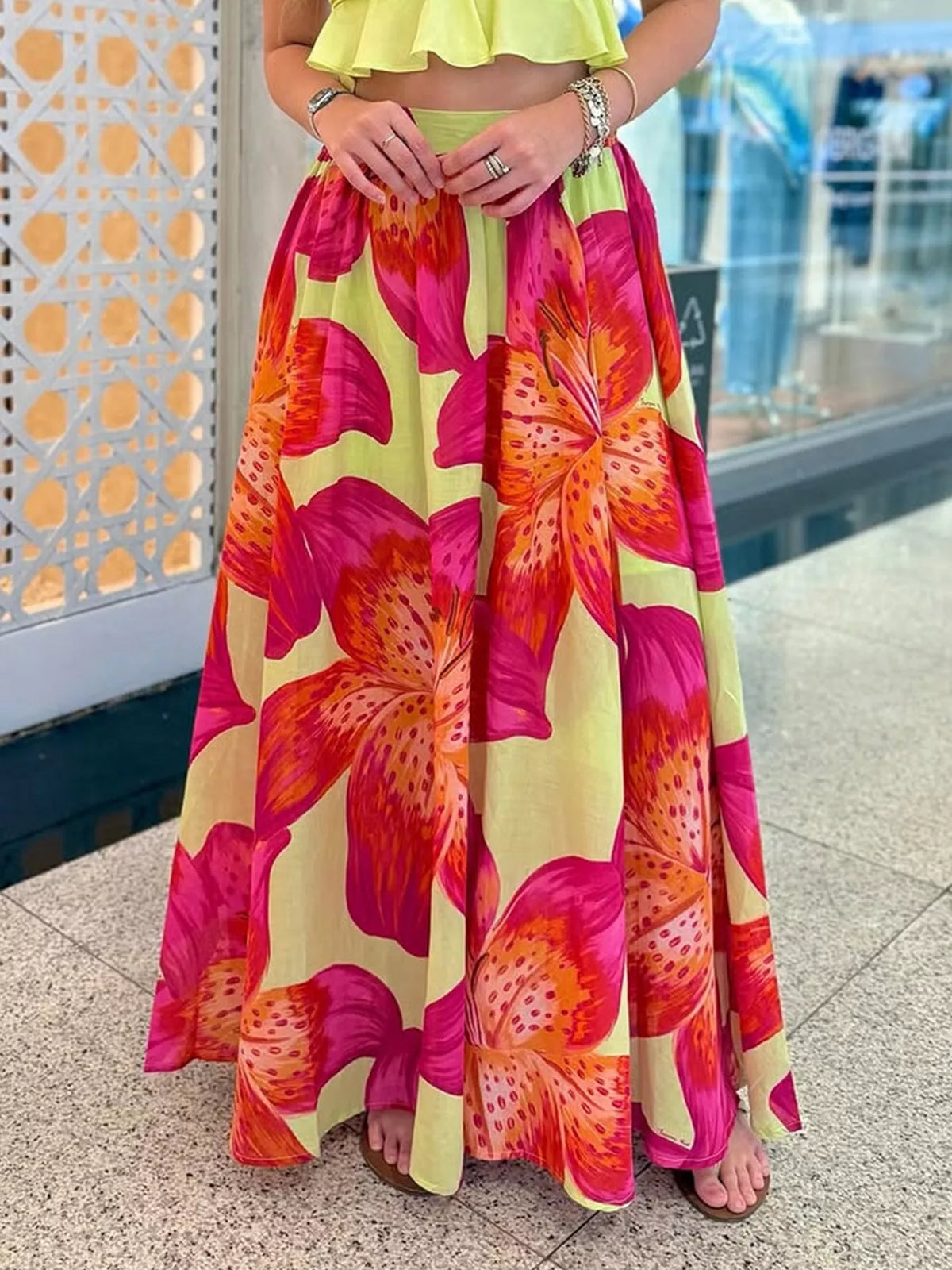 Women's lightweight boho floral print flowy maxi skirt with pockets by Plush Fashion Hub, showcasing its relaxed fit and vibrant pattern.
