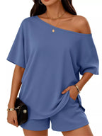 Plus size one-shoulder top and shorts set by Trendsi, featuring a stylish full-size casual outfit with a fitted top and matching shorts.