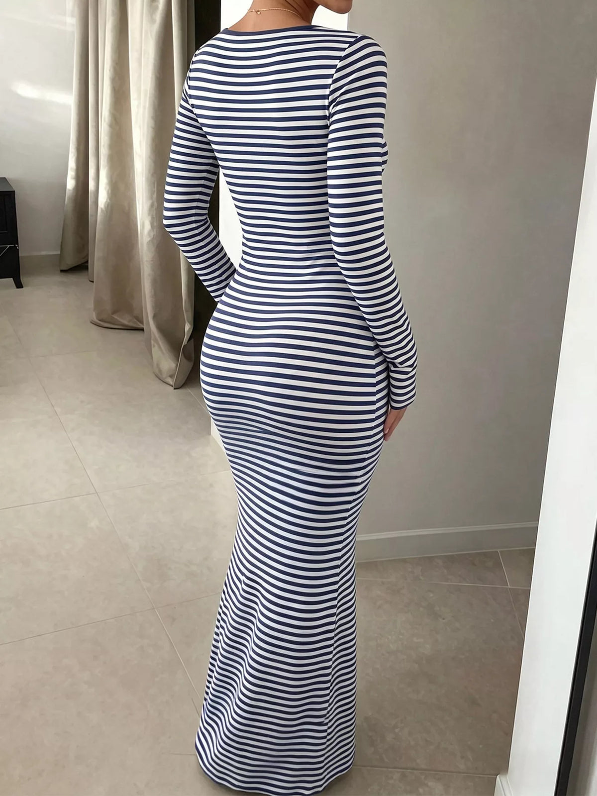 Women's striped long sleeve square neck maxi dress by Trendsi, featuring a fitted silhouette and elegant design.