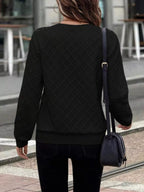 Textured quarter-zip sweatshirt from Trendsi featuring a comfortable fit and stylish design, shown on a neutral background.