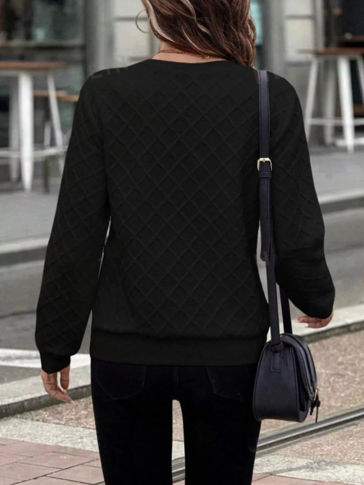 Textured quarter-zip sweatshirt by Plush Fashion Hub, showing soft fabric and stylish design in a close-up view.