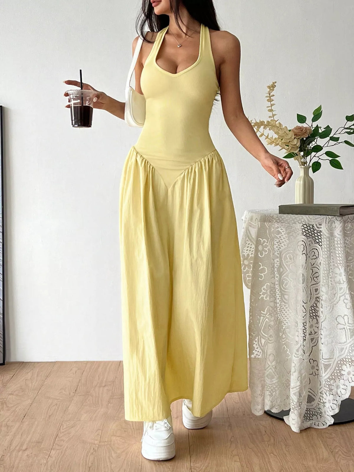 Plush Fashion Hub halter neck ruched maxi dress featuring a fitted bodice and flowing skirt, perfect for elegant summer occasions.